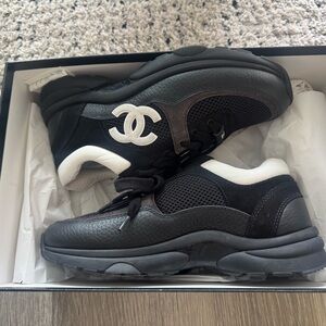 CHANEL women’s  Black and White Sneakers